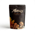 Organic Mornis mushroom coffee cup showcasing the adaptogenic blend for energy, focus, and mental clarity in a cozy setting.